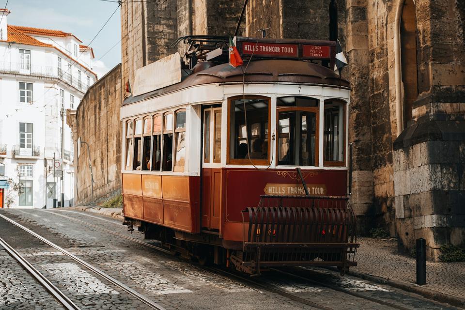 A vintage tram on a Lisbon street.
